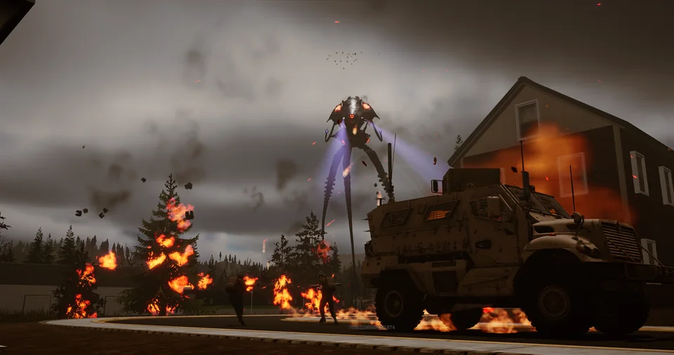 An armored military truck waits beside a burning house as a tripod fires through the smoke beyond.