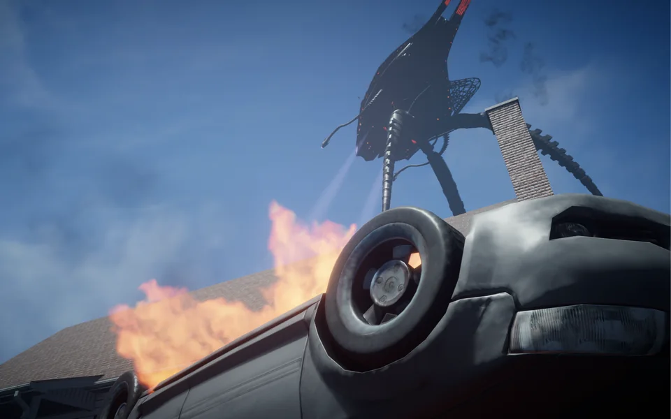 An overturned car burns below an alien machine looming over a rooftop.